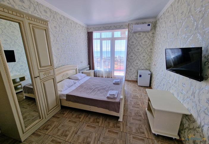 Делюкс четырехместный с балконом и видом на море