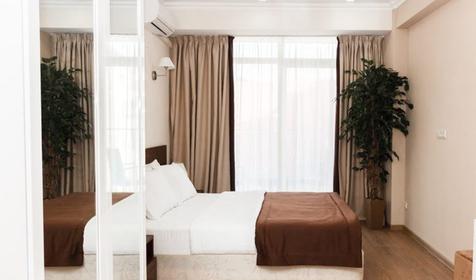 Апартаменты улучшенные четырехместные с кухней и балконом